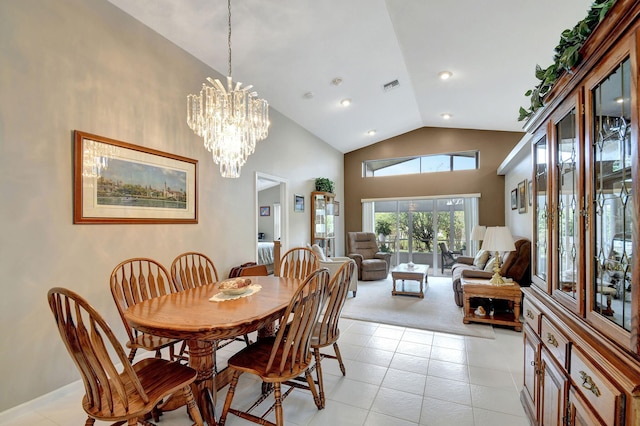 tiled dining area featuring high vaulted ceiling and an inviting chandelier