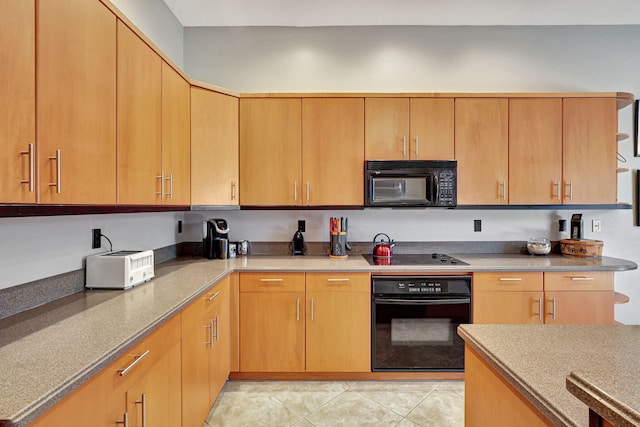 kitchen featuring black appliances and light tile patterned floors