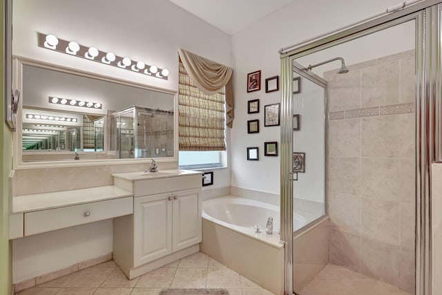 bathroom featuring tile patterned flooring, vanity, and separate shower and tub