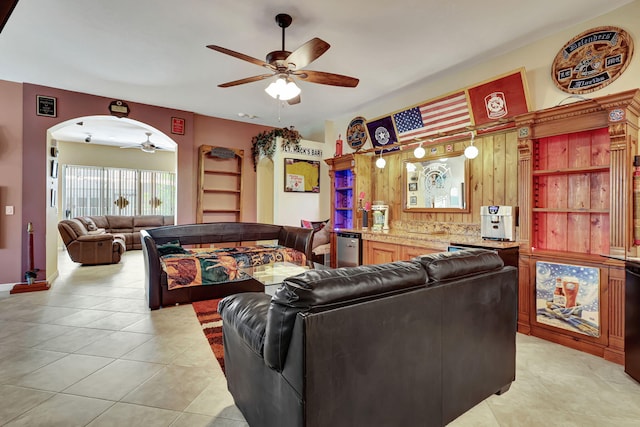 living room featuring ceiling fan and light tile patterned floors