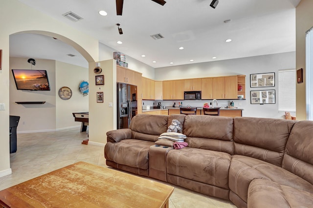 living room with ceiling fan, light tile patterned floors, and billiards