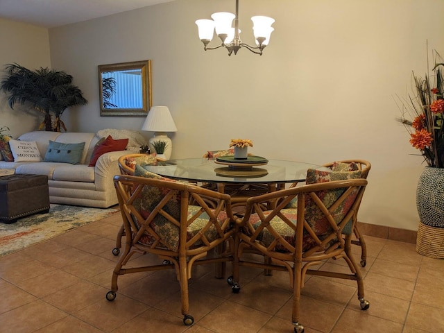 tiled dining area featuring a chandelier