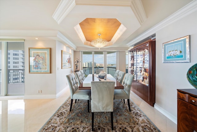 dining area featuring a raised ceiling, tile patterned flooring, a chandelier, and crown molding