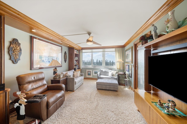 living room featuring ornamental molding, ceiling fan, and carpet flooring