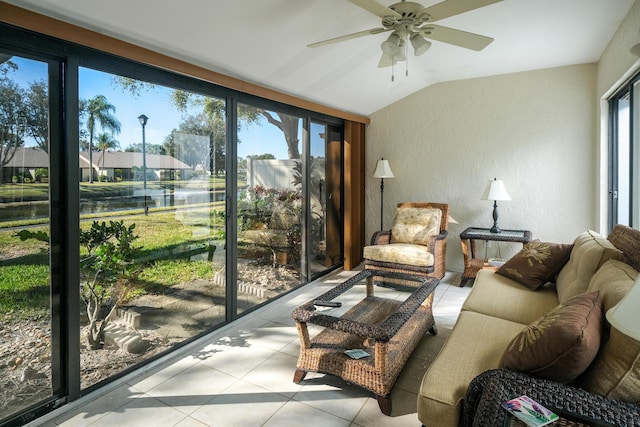 sunroom featuring a water view, ceiling fan, and lofted ceiling