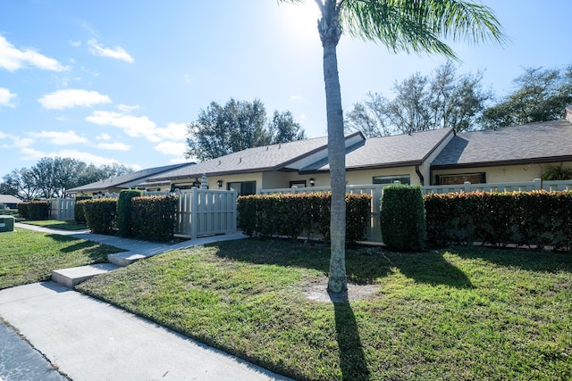 view of side of home featuring a lawn