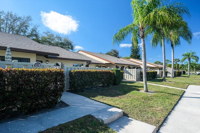 view of side of home with a lawn