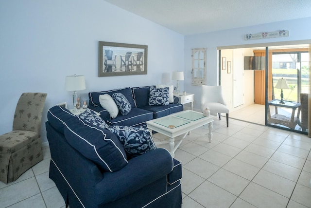 tiled living room featuring vaulted ceiling