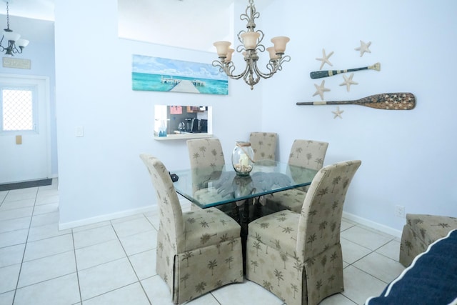 tiled dining area with an inviting chandelier