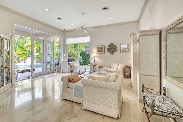 living room featuring french doors, ceiling fan, and crown molding