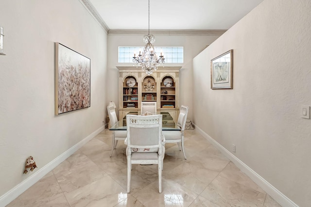 dining area with crown molding and a chandelier