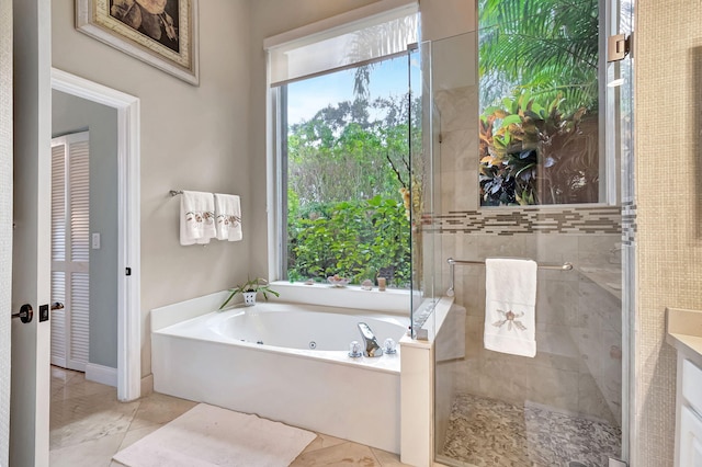 bathroom featuring plus walk in shower and vanity