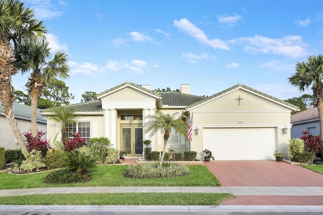 view of front of home featuring a garage and french doors