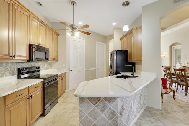 kitchen with sink, kitchen peninsula, pendant lighting, decorative backsplash, and black appliances