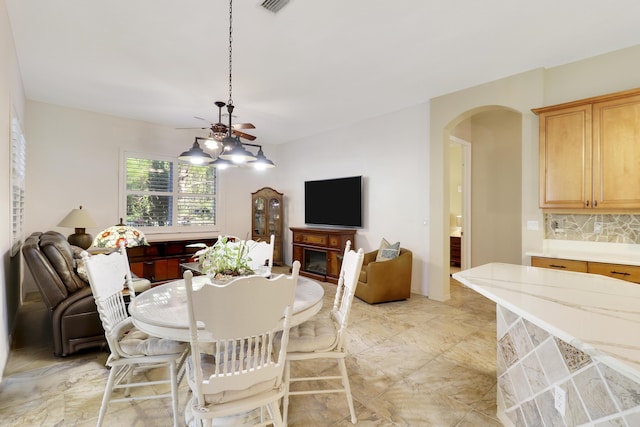 dining area featuring a fireplace