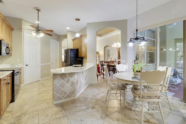 kitchen featuring black appliances, ceiling fan with notable chandelier, pendant lighting, and light brown cabinetry