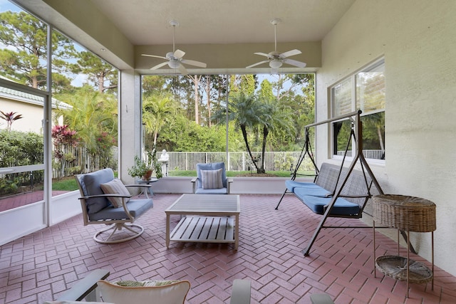 sunroom / solarium with ceiling fan