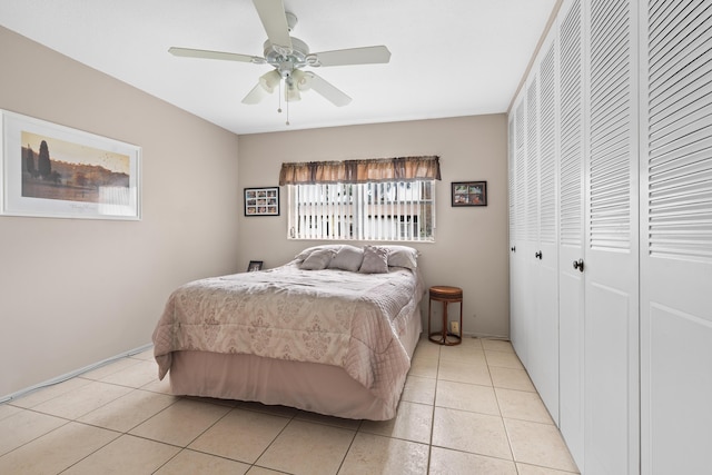 tiled bedroom with ceiling fan