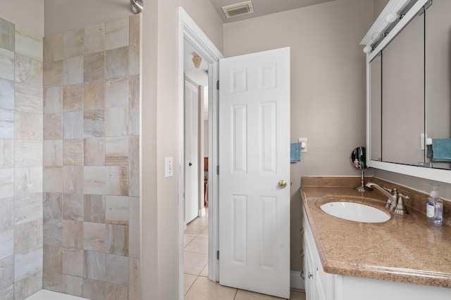 bathroom with tile patterned flooring and vanity