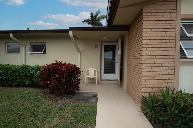 doorway to property with a patio