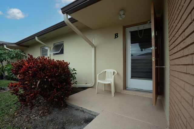 property entrance with a patio area