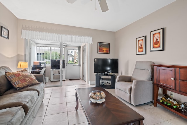 tiled living room with ceiling fan