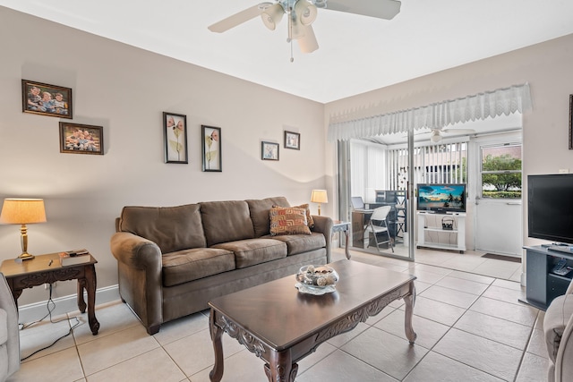 living room with ceiling fan and light tile patterned flooring