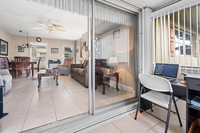 interior space featuring ceiling fan and light tile patterned floors