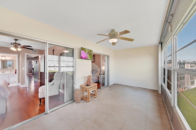 sunroom / solarium with ceiling fan