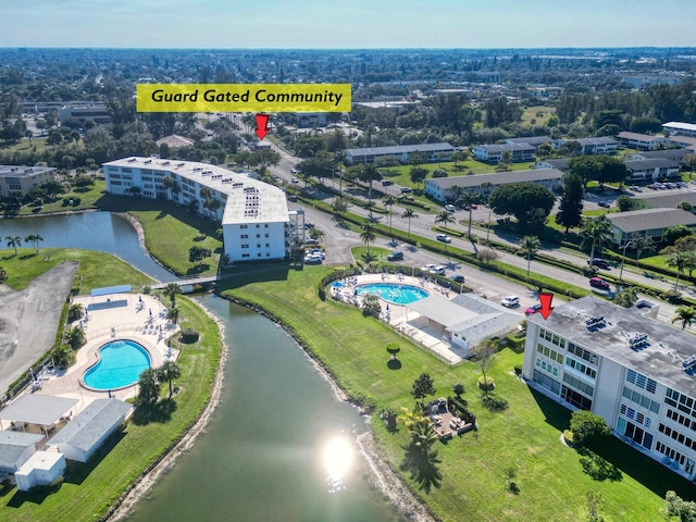 birds eye view of property featuring a water view