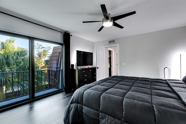 bedroom with ceiling fan, a textured ceiling, hardwood / wood-style flooring, and access to outside