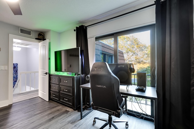 office with light wood-type flooring