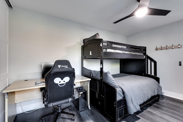 bedroom featuring ceiling fan and wood-type flooring