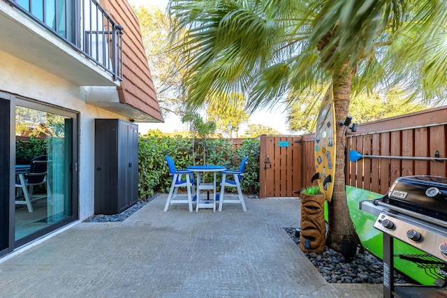 view of patio featuring a grill