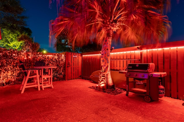 patio at twilight with a grill