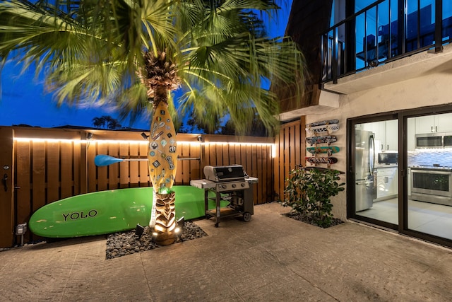 view of patio with a grill