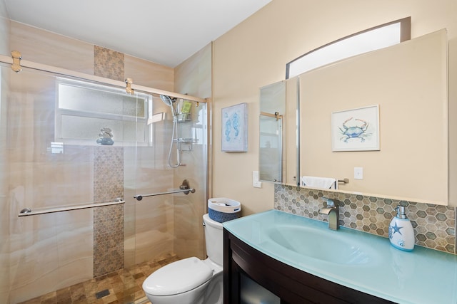 bathroom with toilet, an enclosed shower, tasteful backsplash, and vanity