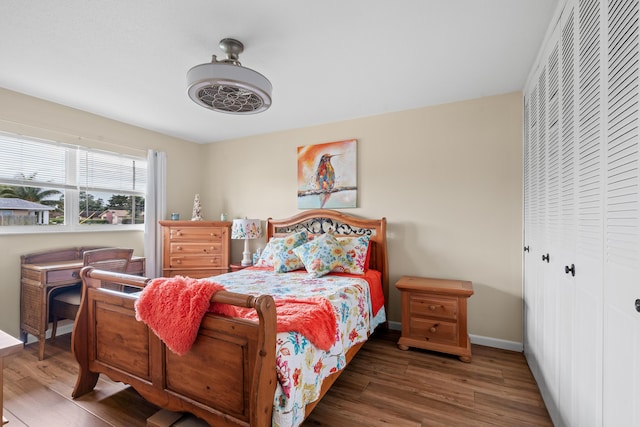 bedroom featuring a closet and dark hardwood / wood-style floors