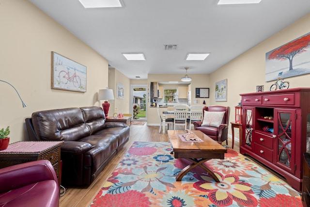 living room with light hardwood / wood-style floors