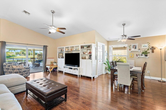 living room with ceiling fan, dark wood-type flooring, and lofted ceiling