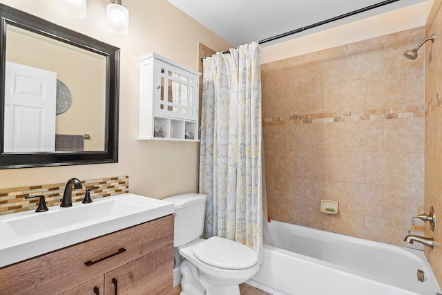 full bathroom with vanity, shower / tub combo, backsplash, and toilet