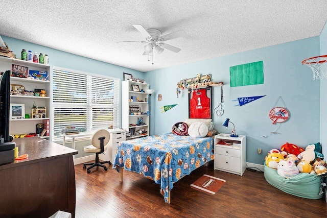 bedroom featuring ceiling fan, dark hardwood / wood-style flooring, and a textured ceiling