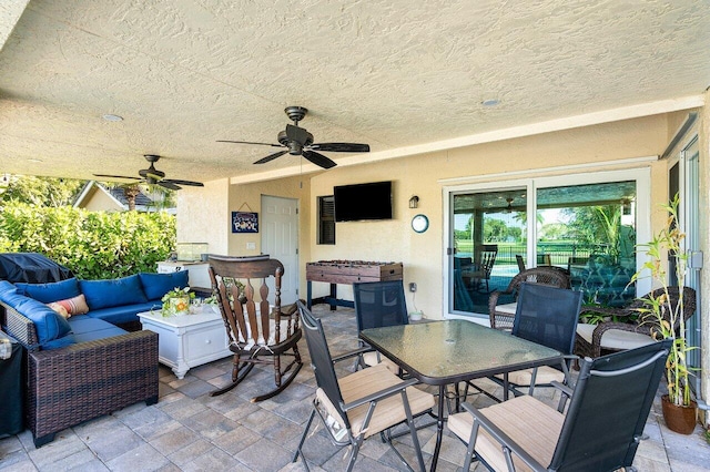 view of patio featuring outdoor lounge area and ceiling fan