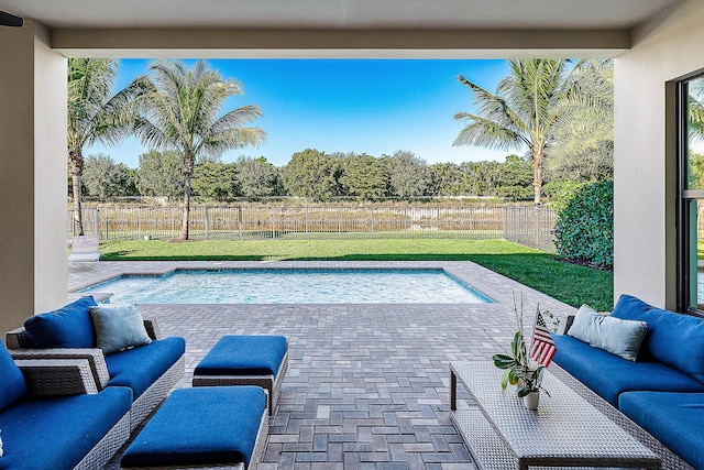 view of pool with a lawn, outdoor lounge area, and a patio