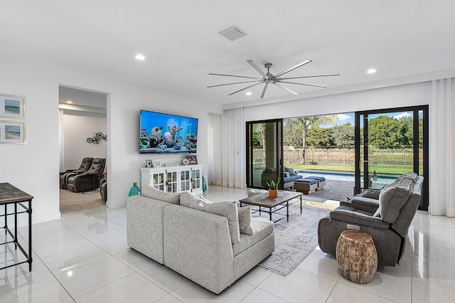 tiled living room with ceiling fan