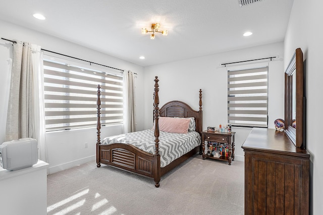 bedroom featuring light carpet