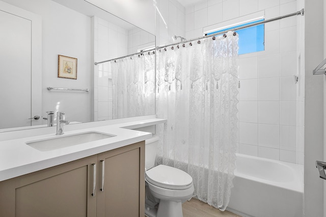 full bathroom featuring toilet, vanity, and shower / tub combo with curtain