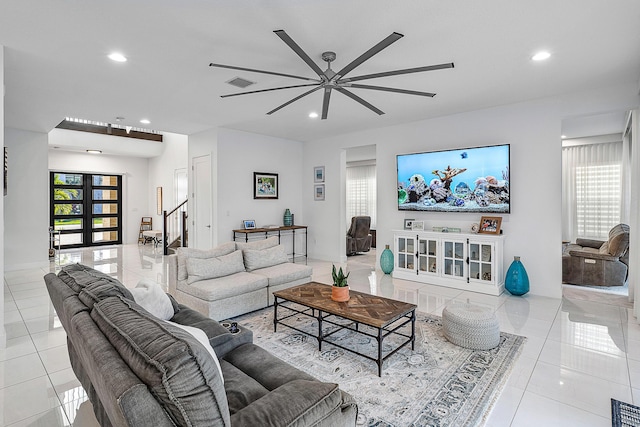 tiled living room featuring a healthy amount of sunlight