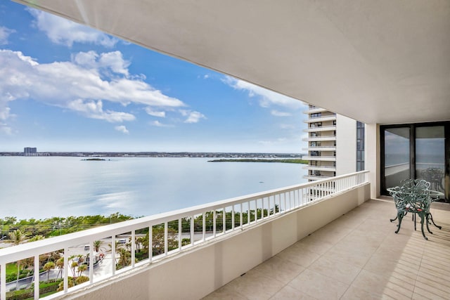 balcony featuring a water view