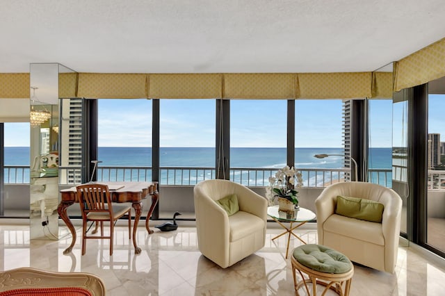 sunroom / solarium with a water view